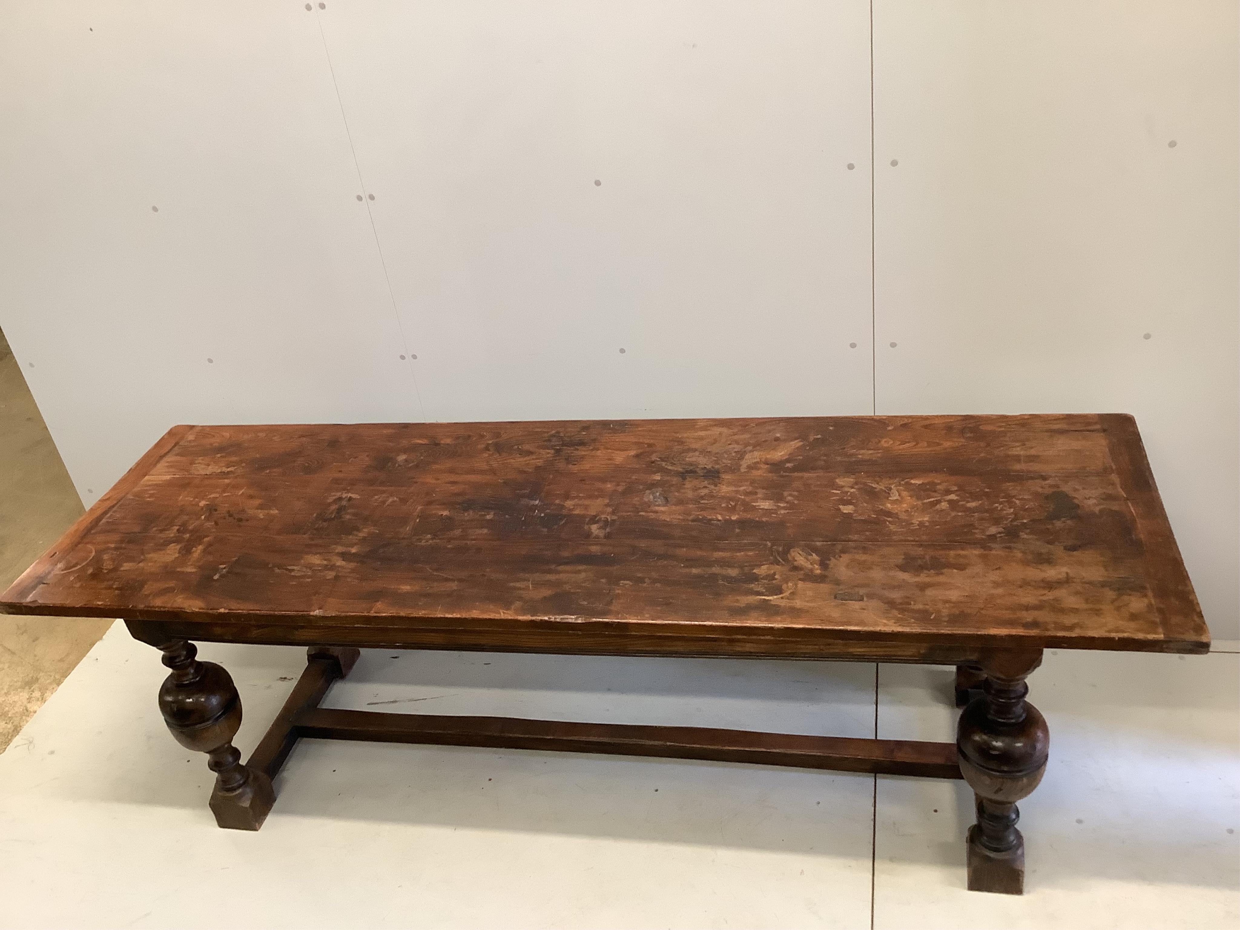 A 17th century style rectangular oak refectory dining table, width 242cm, depth 77cm, height 76cm. Condition - fair